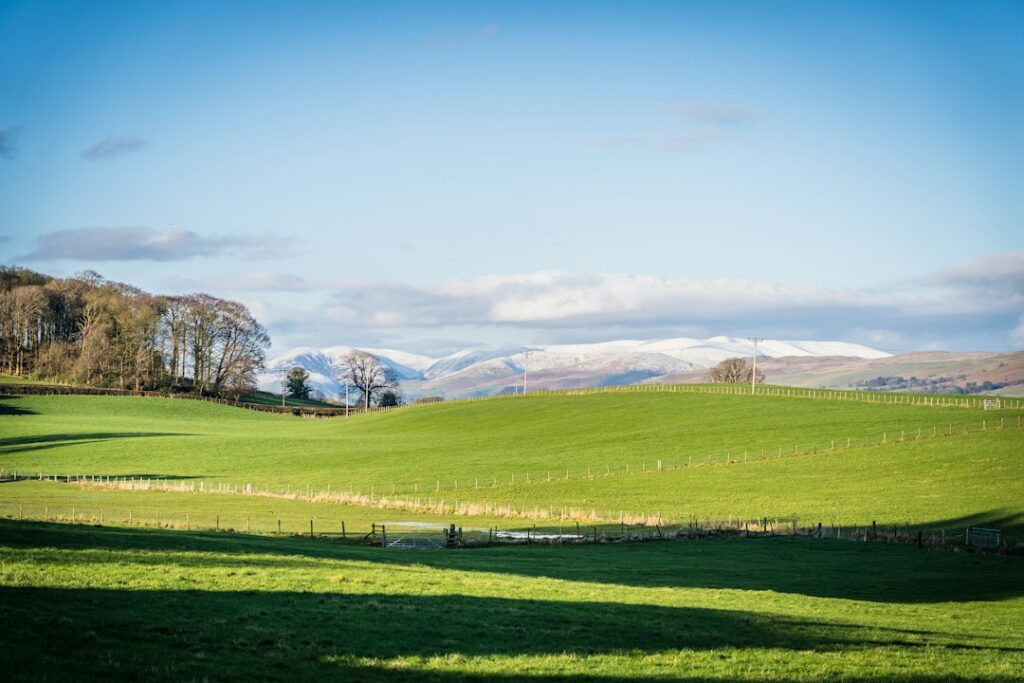Green Cumbrian hills and open valley landscape along the Westmorland and Furness Way